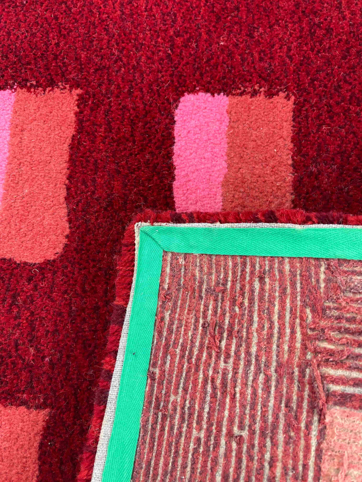 'Mulled' Hand tufted red, pink and burgundy small tufted rug