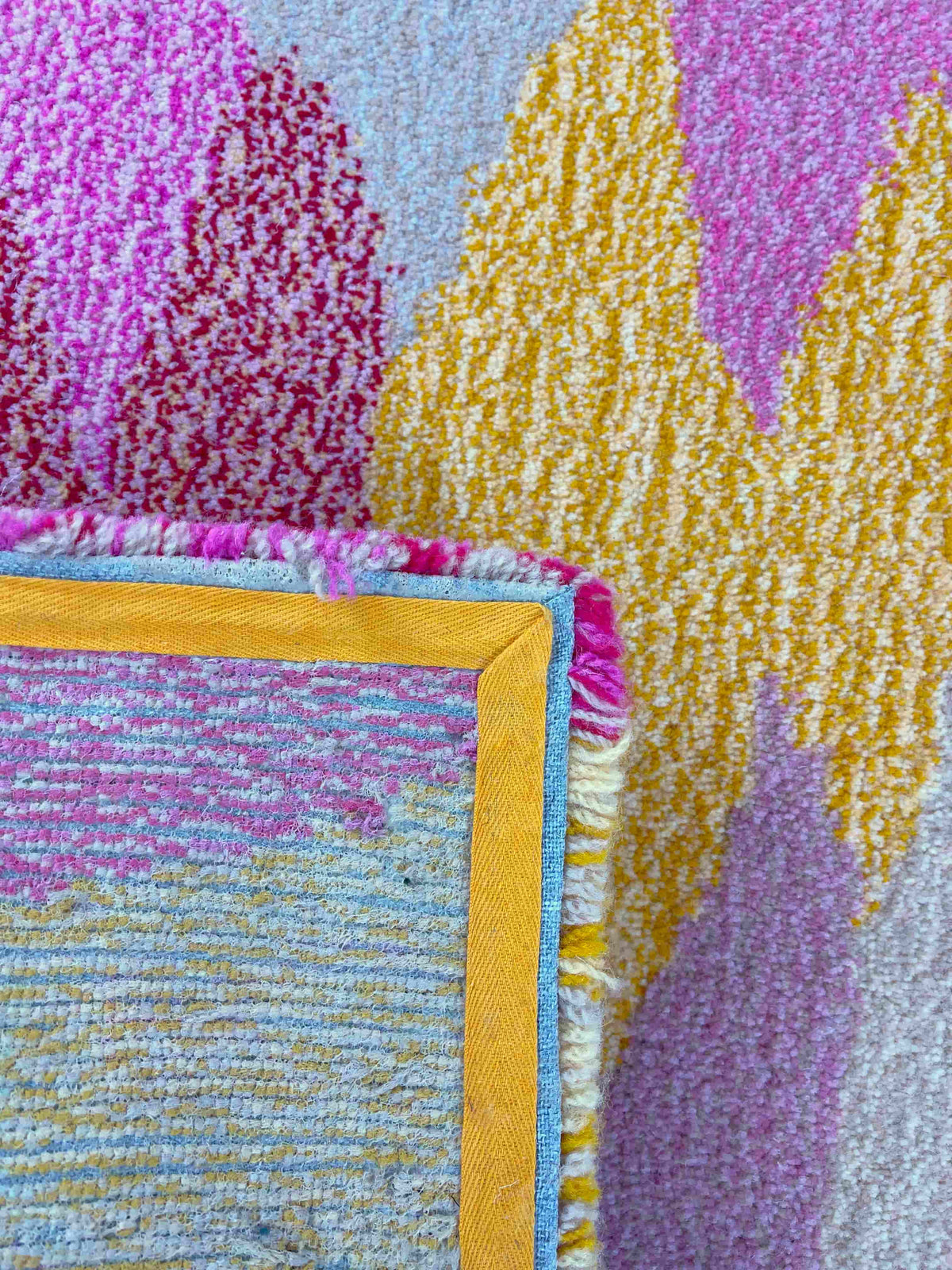 'Petal' Hand tufted small cream, yellow and candy pink tufted rug