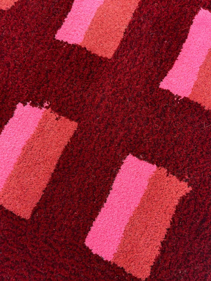 'Mulled' Hand tufted red, pink and burgundy small tufted rug