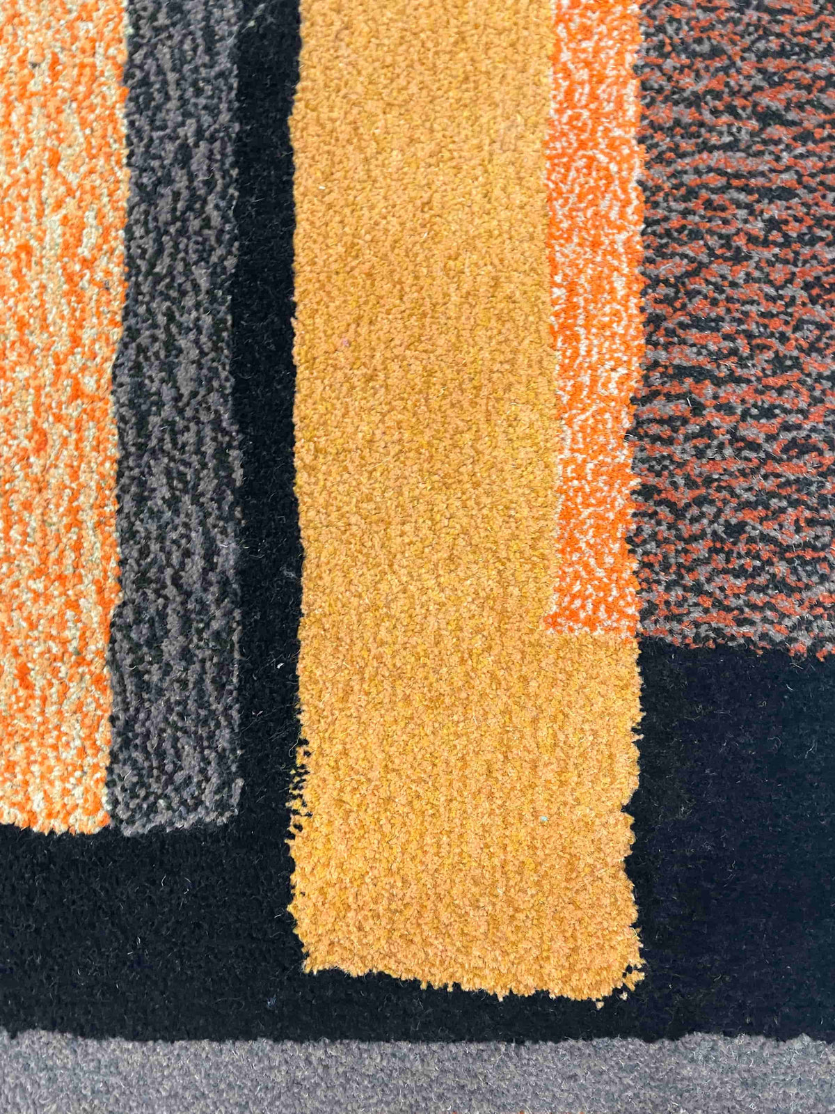 'Thunder' Hand tufted black, orange and mustard tufted rug