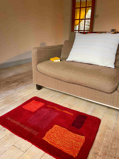 'Flare' Hand tufted burgundy, red and orange small tufted rug