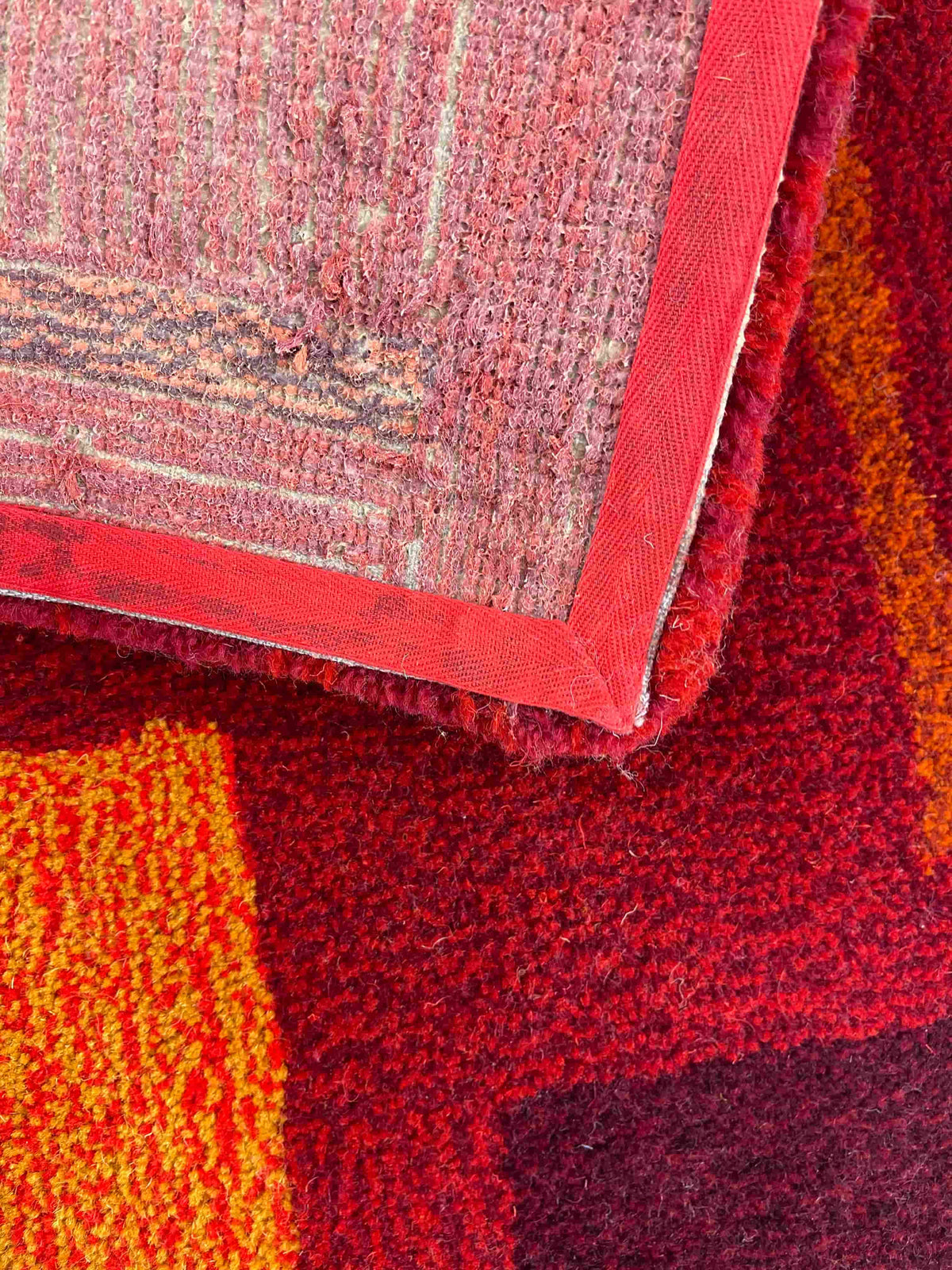 'Flare' Hand tufted burgundy, red and orange small tufted rug