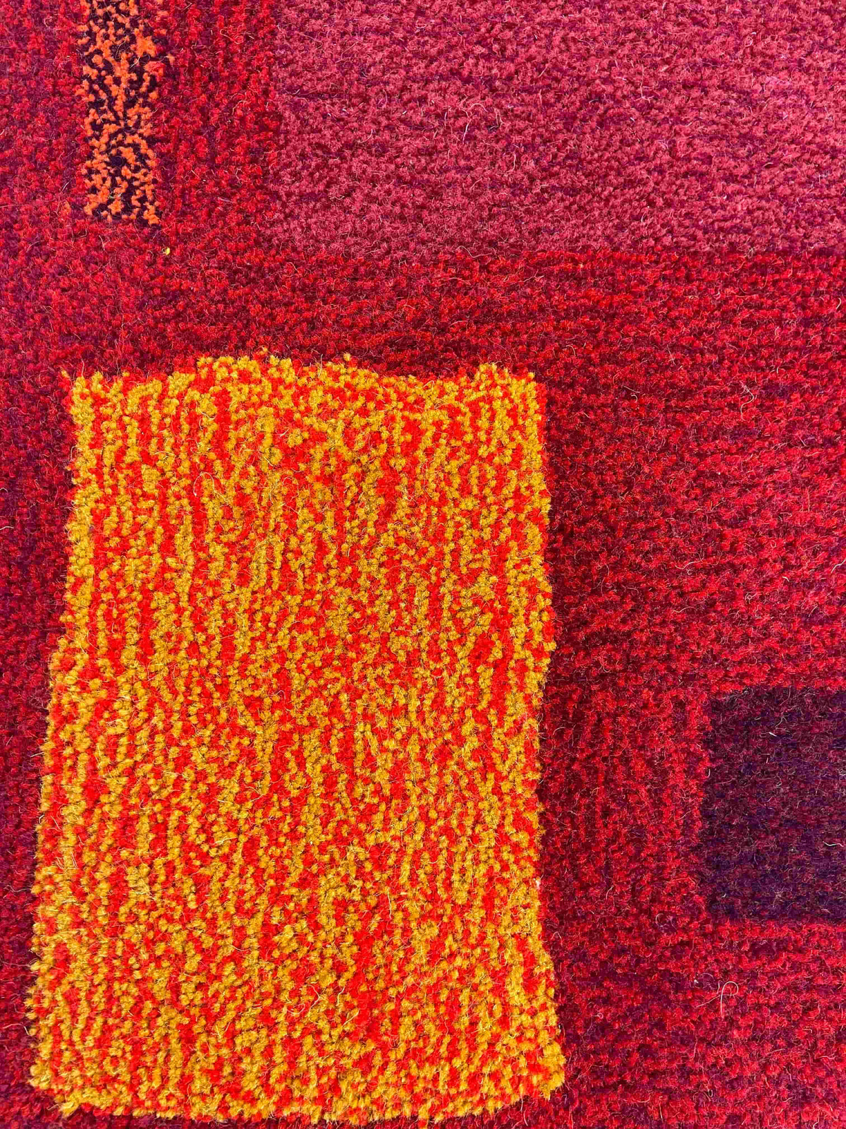 'Flare' Hand tufted burgundy, red and orange small tufted rug